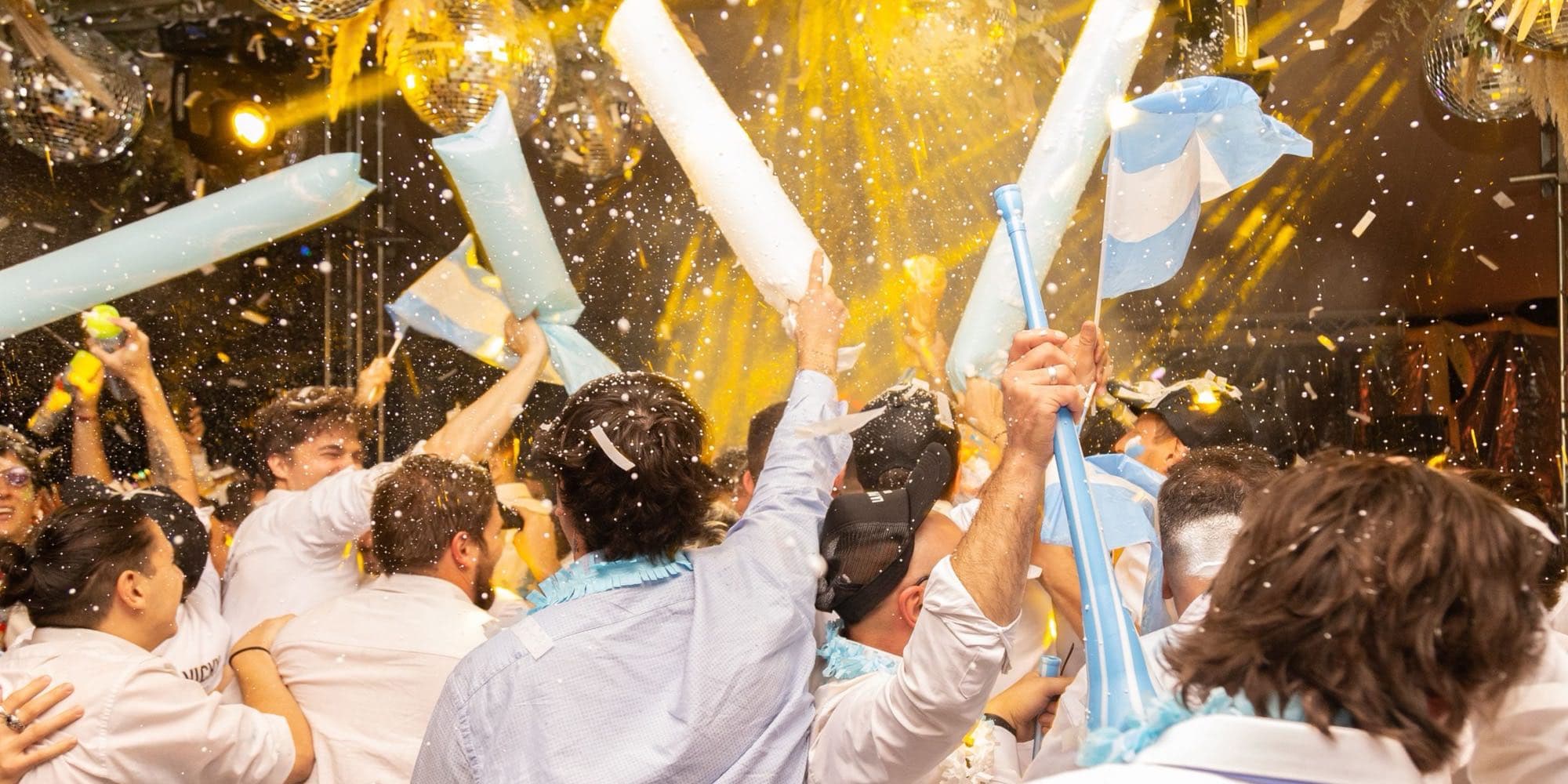 Members celebrating under confetti at the end of season party